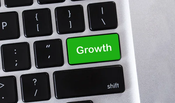 Text Growth on green button of keypad — Stock Photo, Image