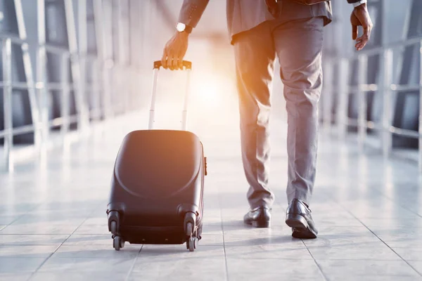 Businessman Carrying Suitcase, Walking Through Passenger Boarding Bridge