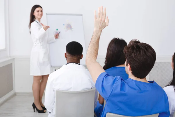 Medical Doctor Giving Lecture, Active Intern Having Question