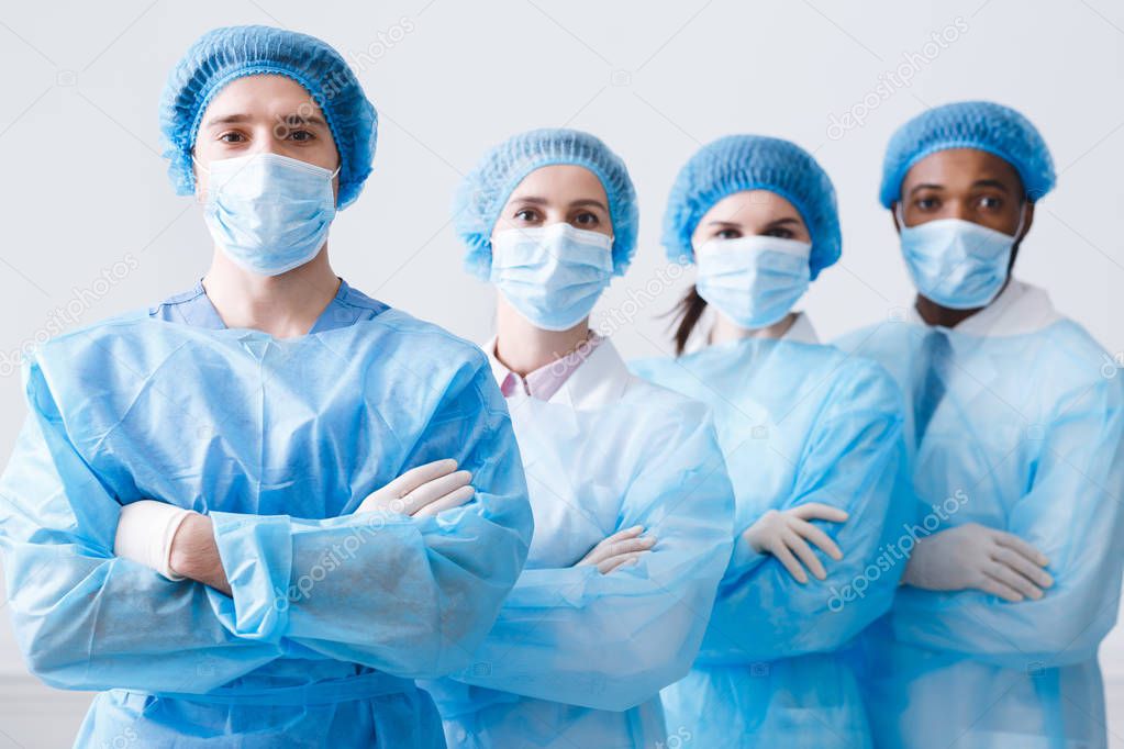 Surgeons Team Ready for Surgery. Practitioners Wearing Protective Uniforms
