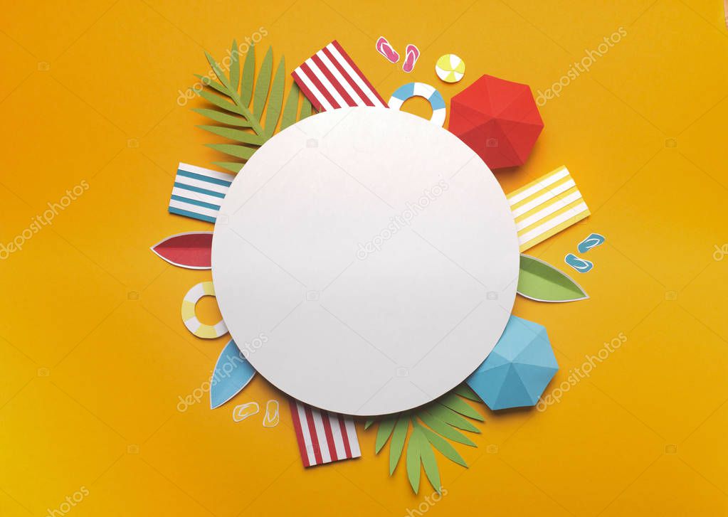 Composition of beach accessories on yellow background