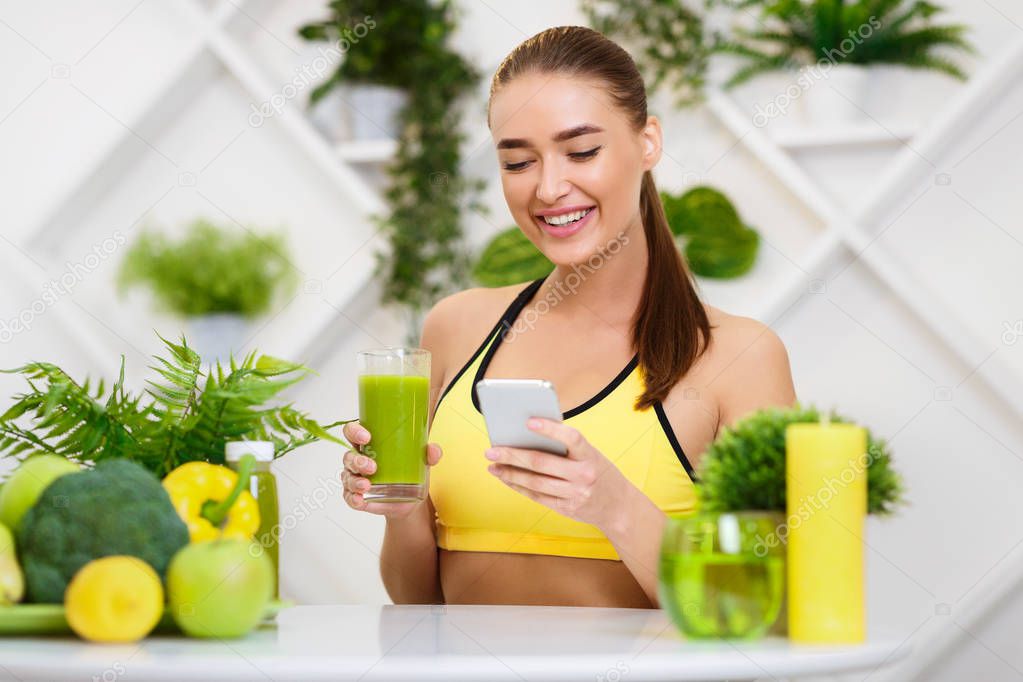 Download Girl Drinking Detox Juice And Texting On Phone — Stock ...