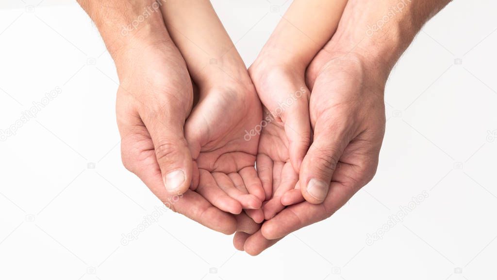 Father and daughter holding something in hands