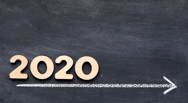 2020 concept on time line with arrow on chalk background — Stock Photo, Image