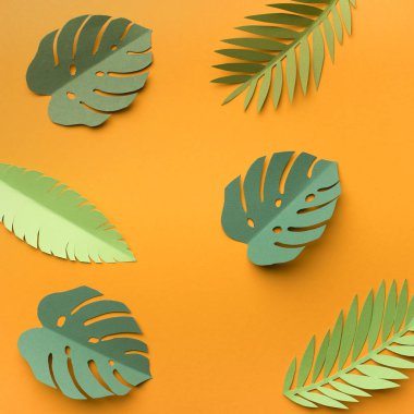 Summer background with tropical green leaves on yellow clipart