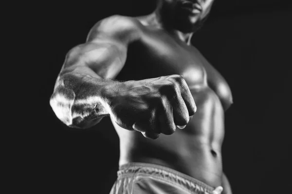 Muscular african bodybuilder demonstrating his fist and vein — Stock Photo, Image
