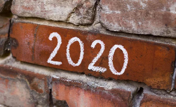 Handwriting text 2020 on old red city bricks wall — Stock Photo, Image