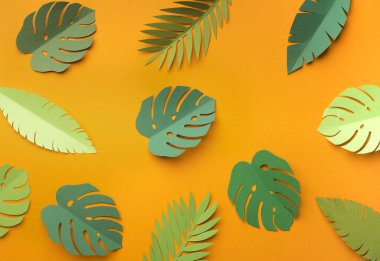 Plenty of jungle leaves on yellow summer background clipart