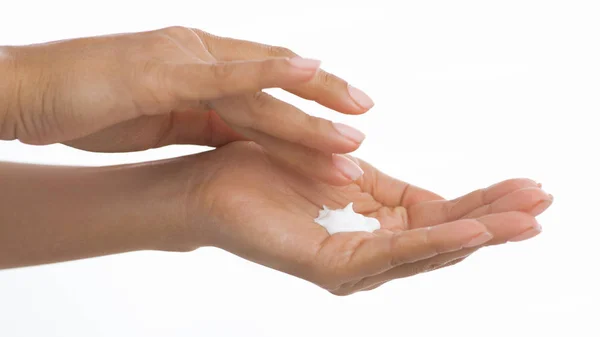 Woman Applying Moisturizing Cream on Hands, White Background — Stock Photo, Image