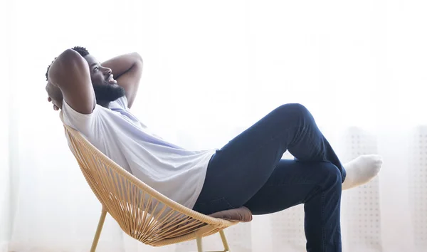 Millennial african american guy relaxing at home — Stok Foto