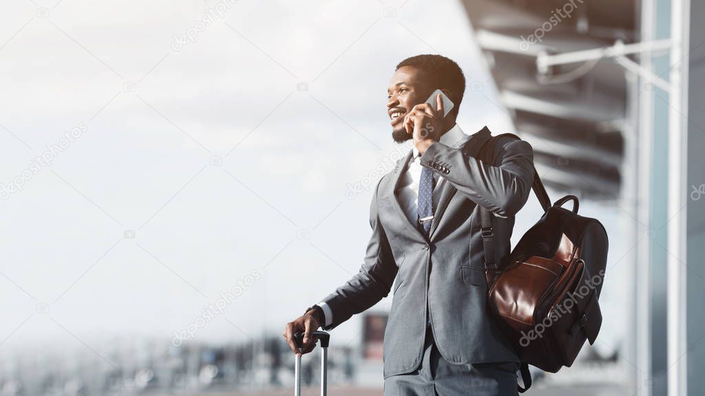Always in Touch. Entrepreneur Talking on Phone at Airport