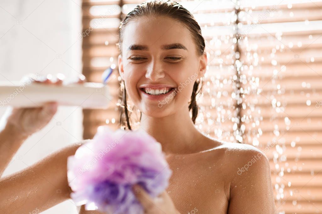 Happy Girl Putting Shower Gel On Puff