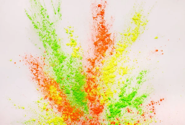 Abstract colorgul poeder explosie op witte achtergrond — Stockfoto