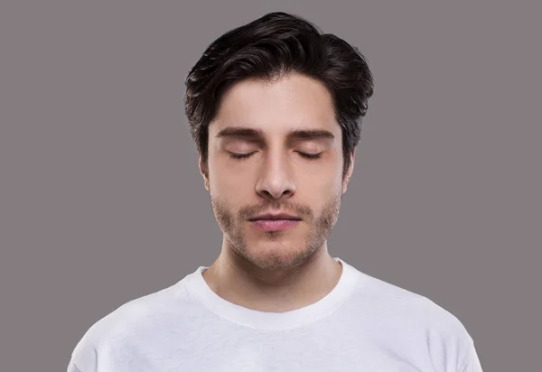 Portrait of handsome millennial man with closed eyes — Stock Photo, Image