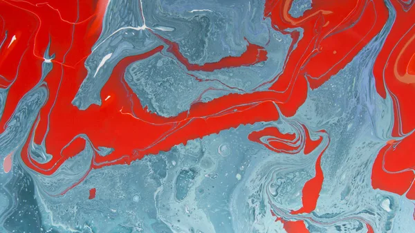 Red and blue stains on creative modern abstract painting