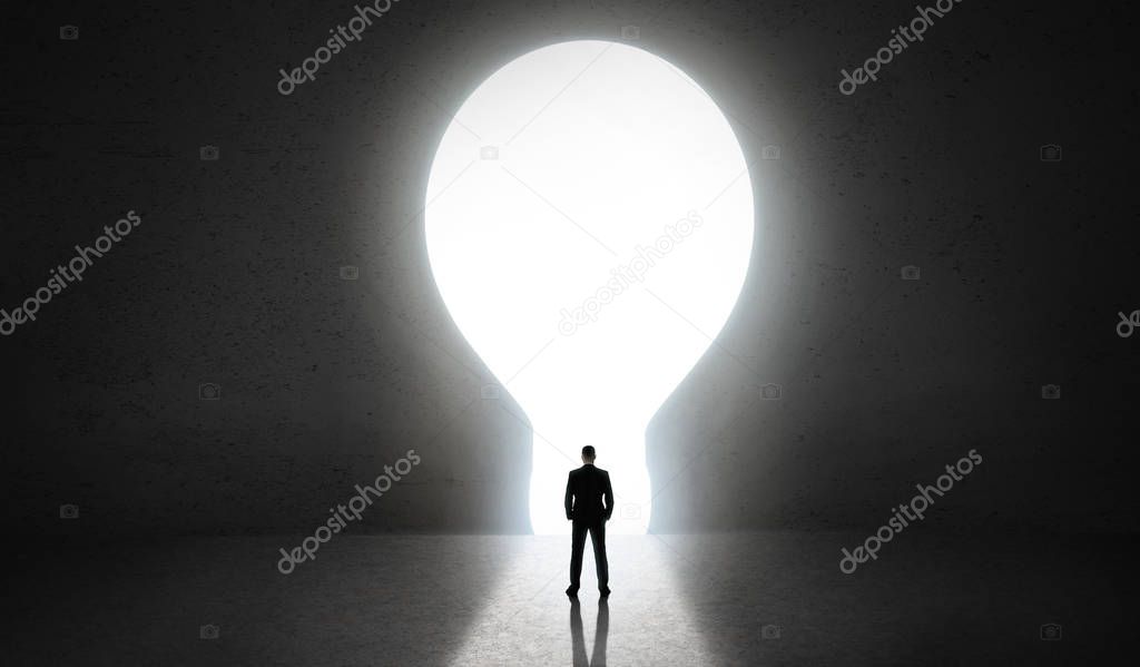 Man standing in front of hole in concret wall