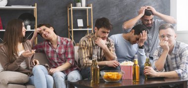 Four male friends frustrated after watching football game clipart