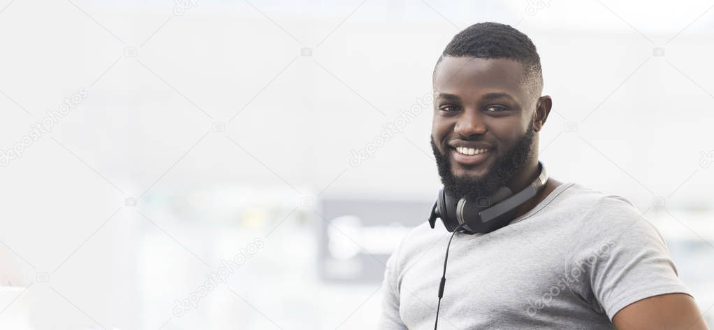 Portrait of smiling african american guy with headphones