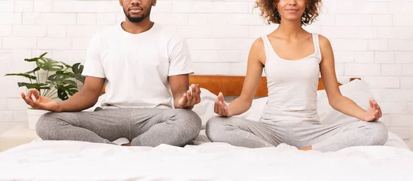 stock image Young black family meditating in bed together