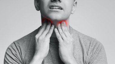 Man with thyroid gland problem, touching his neck clipart