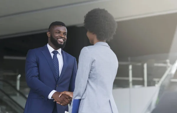 Businessman shaking hands with his female partner celebrating successful teamwork — Stock Photo, Image