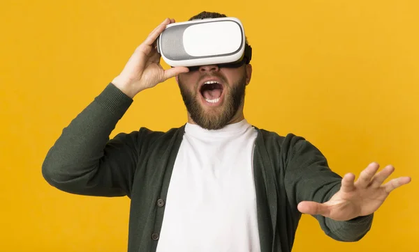 Excited man having good time with vr glasses on — Stock Photo, Image
