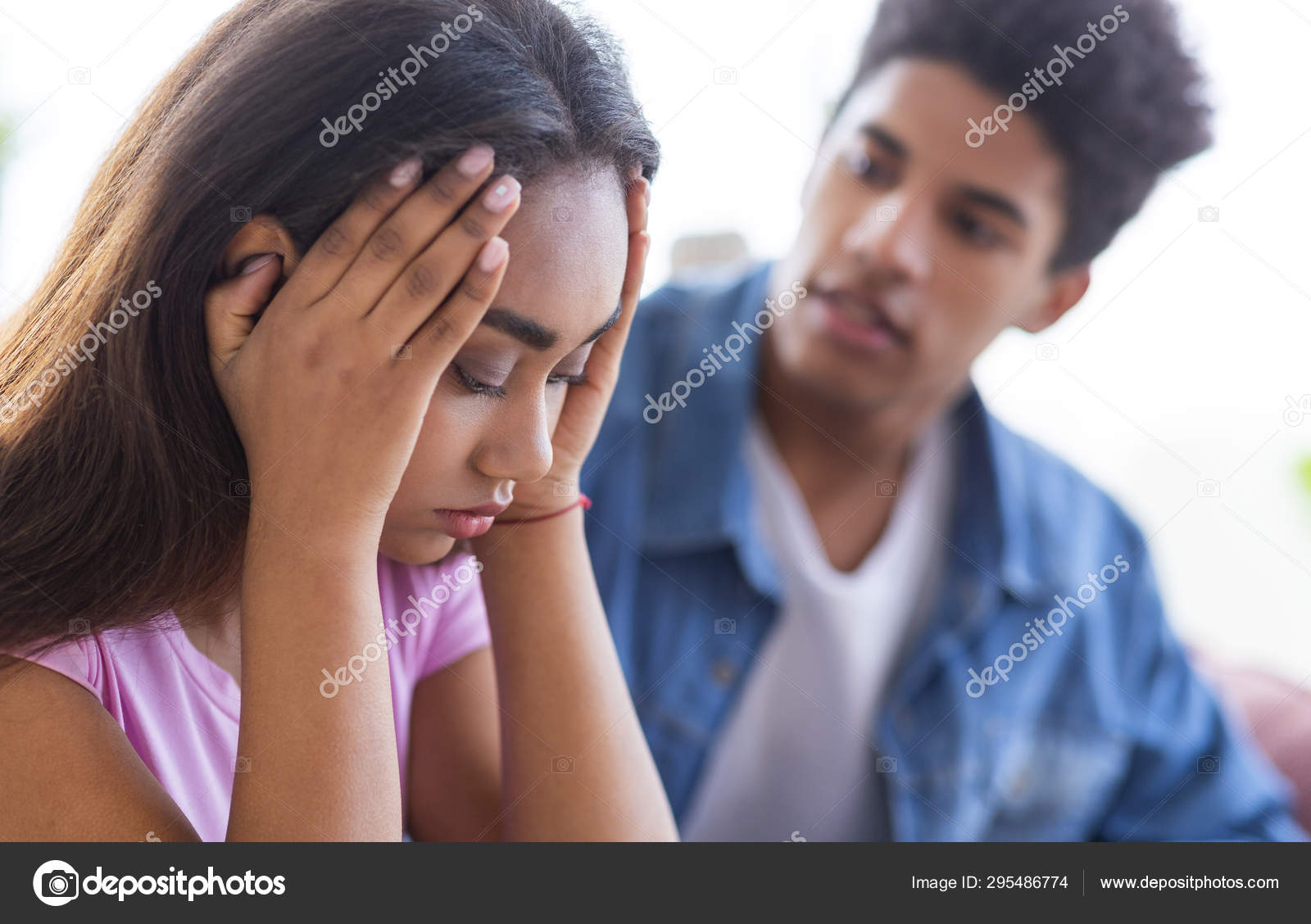 Black Teen Guy Comforting His Upset Female Friend Stock Photo