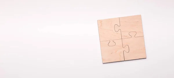 Puzzle aus vier Holzteilen mit Kopierraum für Text — Stockfoto