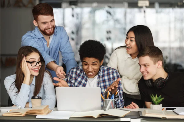 Surprised students finding out test results on laptop — Stock Photo, Image