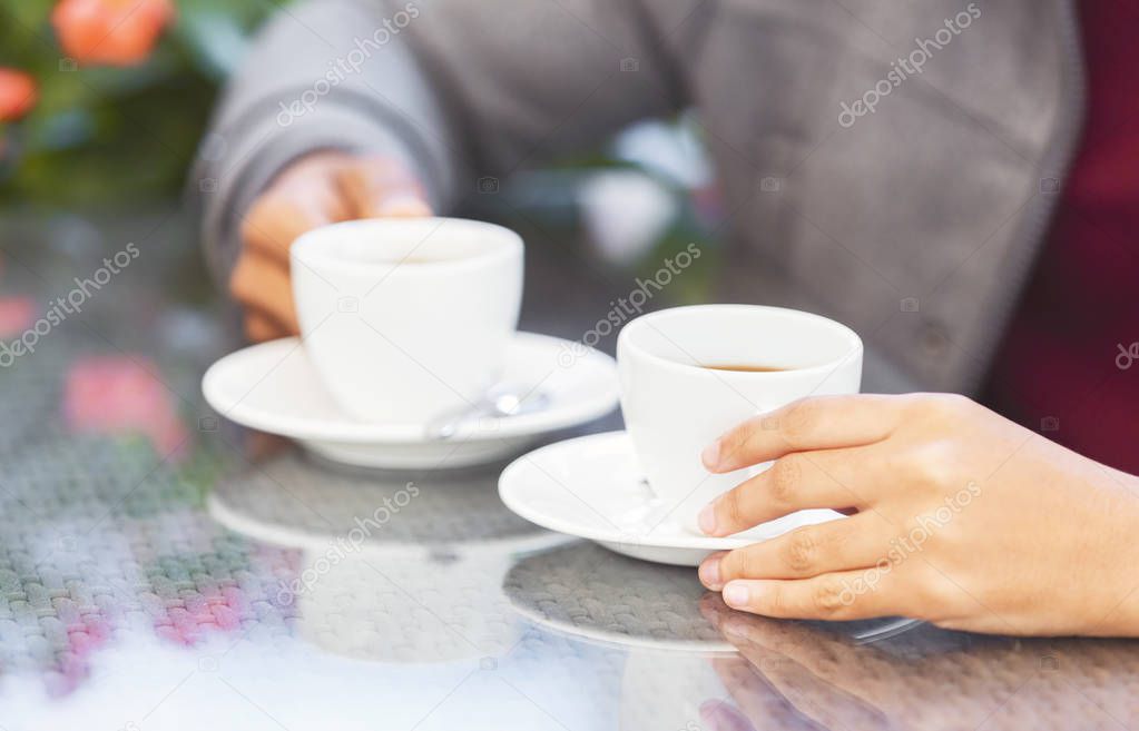 African american man and woman having coffee break together