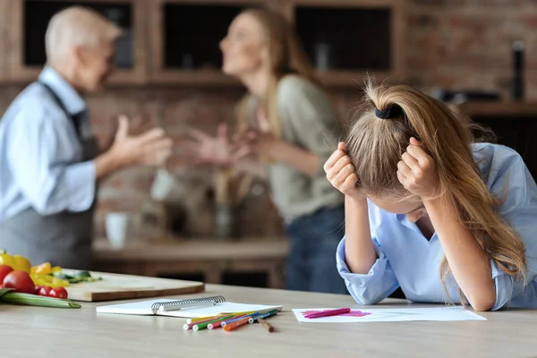 Upset girl crying while her mom and granny fighting — Stock Photo, Image