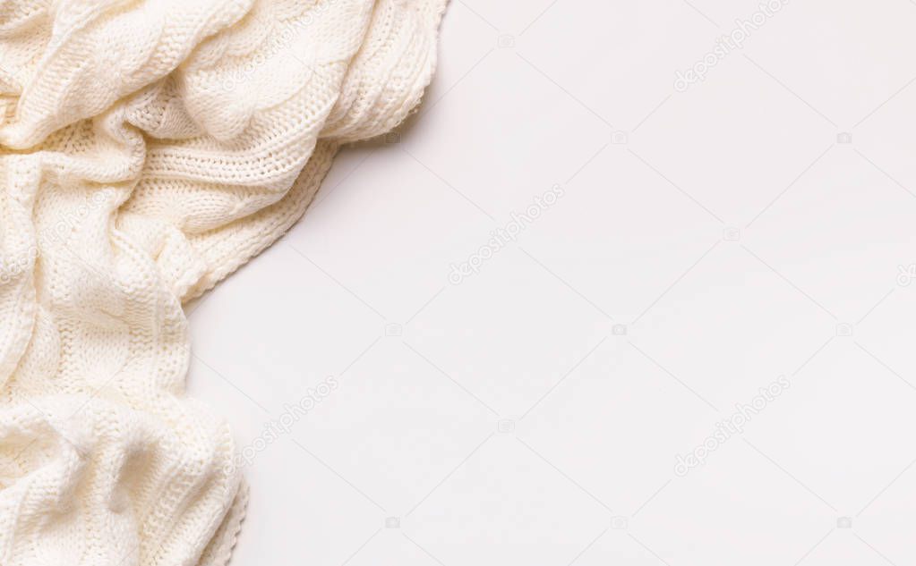 White autumn warm scarf on white background with copy space