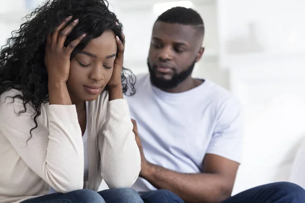 Loving african man soothing upset girlfriend, apologizing after quarrel — Stock Photo, Image