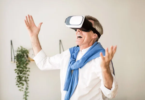 Augmented reality. Mature man with virtual headset