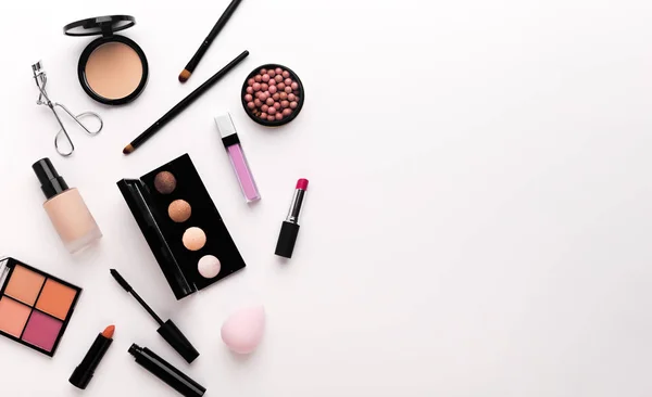 Luxury makeup products creating frame on white — Stock Photo, Image