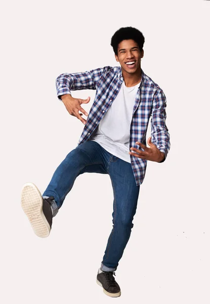 Happy african-american guy having fun over white background — Stock Photo, Image