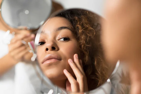 Afro Woman Looking In Mirror Touching Face at Bathroom — Stok Foto