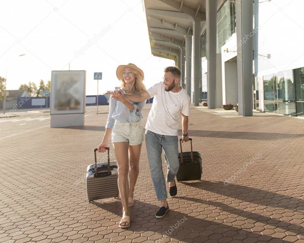 People travel. Couple near airport, going on trip