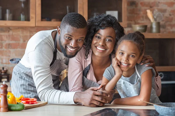 Cheerful african family spending time together at kitchen — Stock Photo, Image