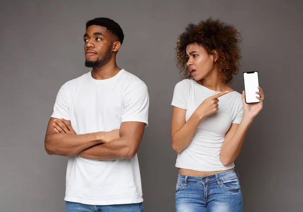 Irritated african american girlfriend asking for explanation from her boyfriend — Stock Photo, Image