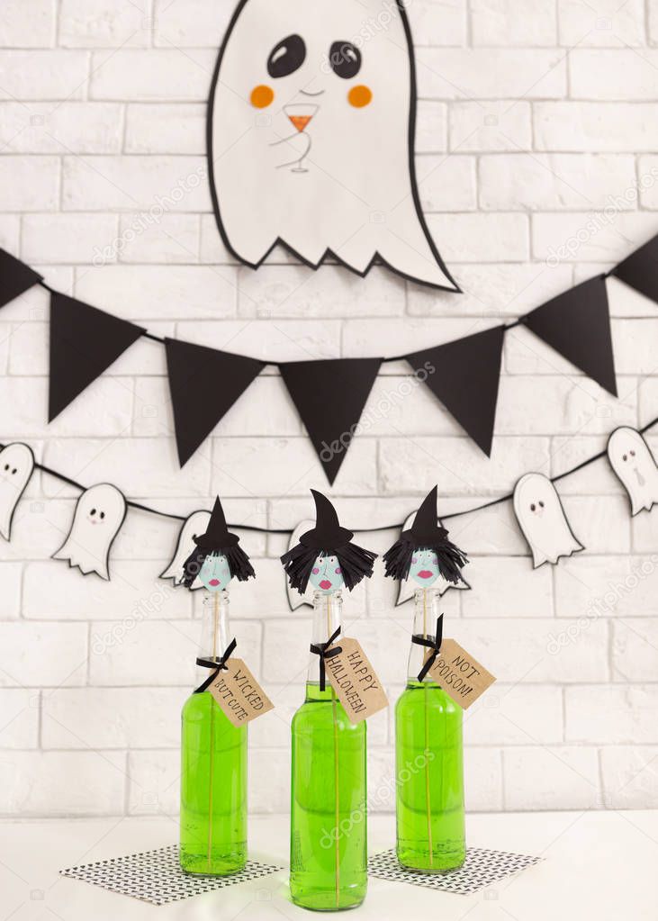 Creative children green Halloween cocktails with cute ghost