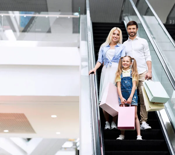 stock image Young Parents And Daughter Standing On Escalator In Shopping Mall