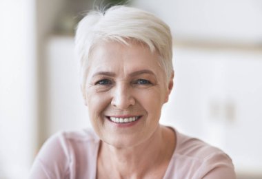 Portrait of senior business lady smiling at camera