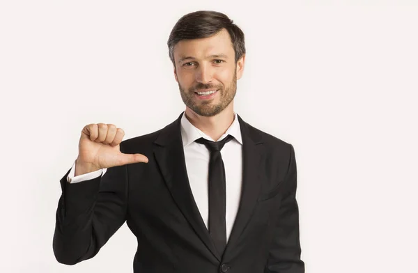 Business Guy Pointing Thumbs at Himself, White Background, Studio Shot — стокове фото