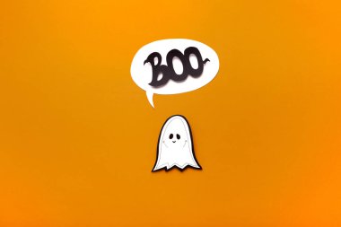 Ghost kid saying boo on orange Halloween background