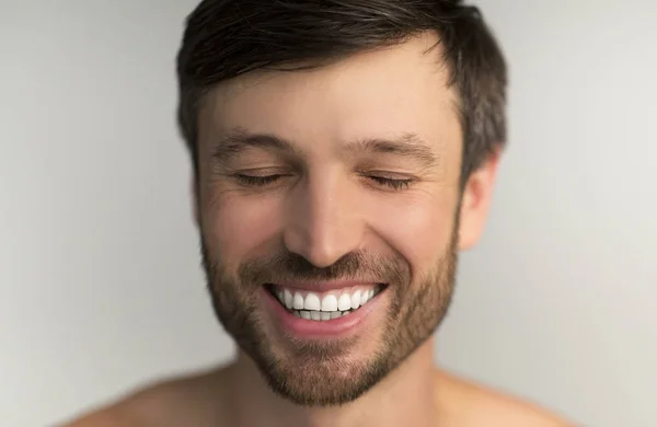 Middle Aged Man Smiling With Closed Eyes In Studio — Stock Photo, Image