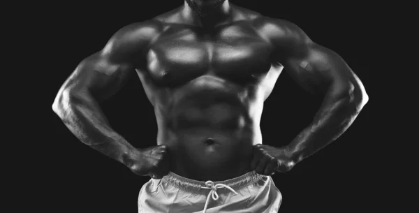 Black and white photo of muscular sportsman — Stock Photo, Image