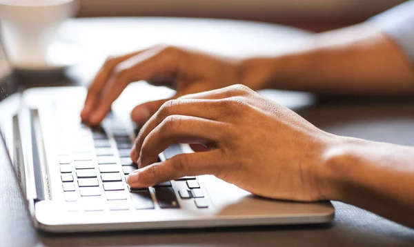 Male hands typing text or programming code on laptop — Stock Photo, Image