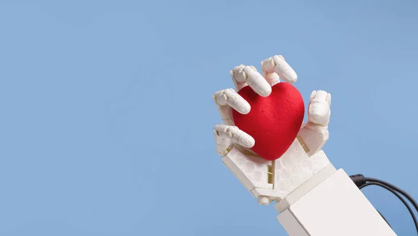 Robot hand holding red heart, blue panorama background — Stock Photo, Image