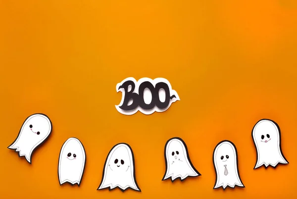 Happy Halloween background with ghost and text on orange — Stok Foto